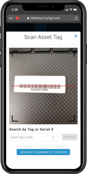 Phone showing asset tracking software in action with barcode scanner